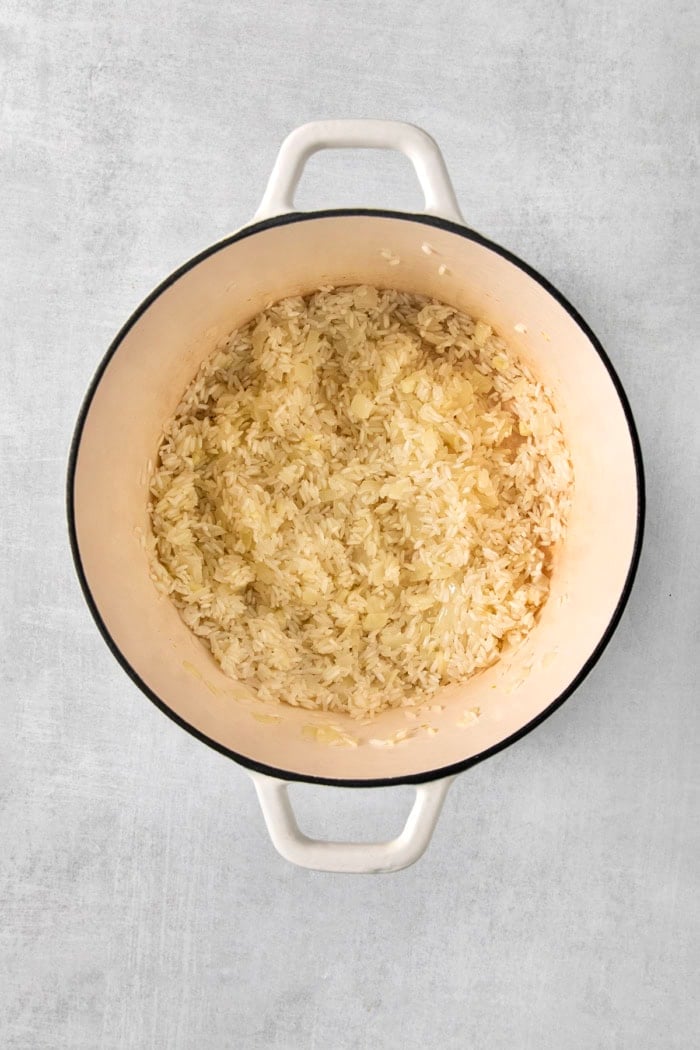Long grain white rice in pot before cooking.