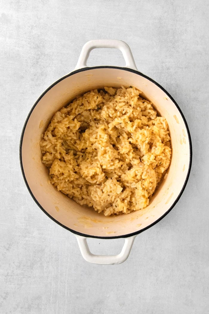 Cheesy rice in pot.