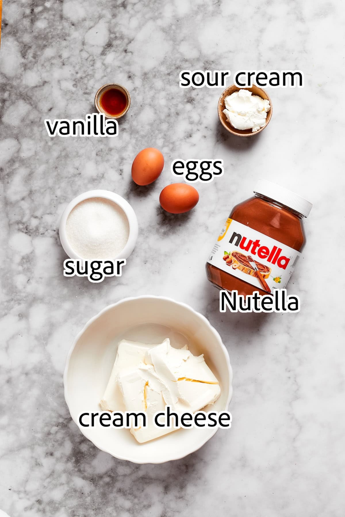 These Nutella cheesecake bars top a fudgy brownie base with creamy Nutella cheesecake for a rich, decadent dessert that’s surprisingly easy! ingredients needed to make the Nutella cheesecake layer