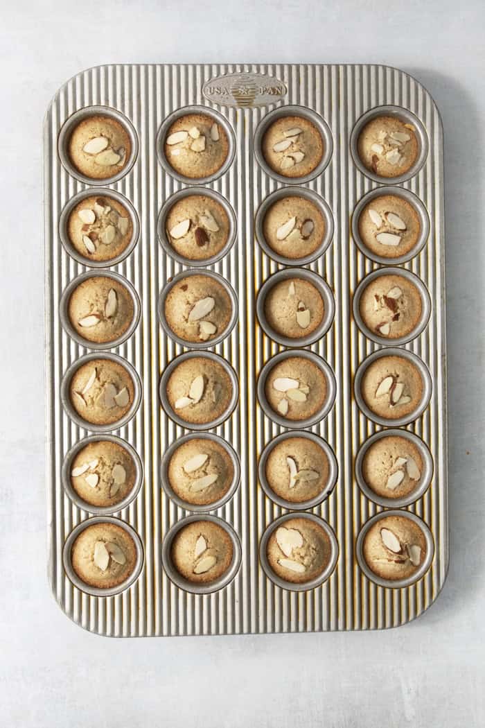 Financiers are an elegant treat that feels straight from a French bakery! My version is made in a muffin pan, so it's easy for home bakers. Financiers in mini muffin tin.
