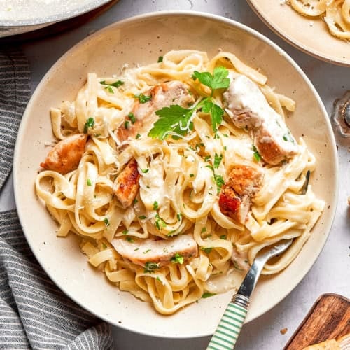 overhead photo of a plate of chicken fettuccine Alfredo