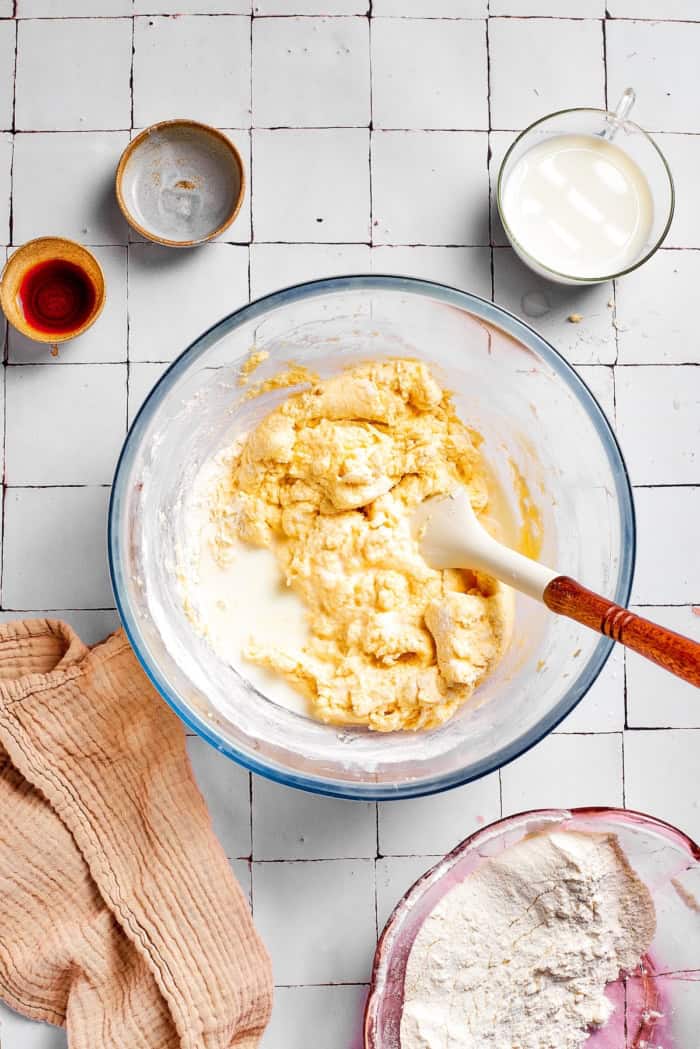 Mixing milk into cake batter.