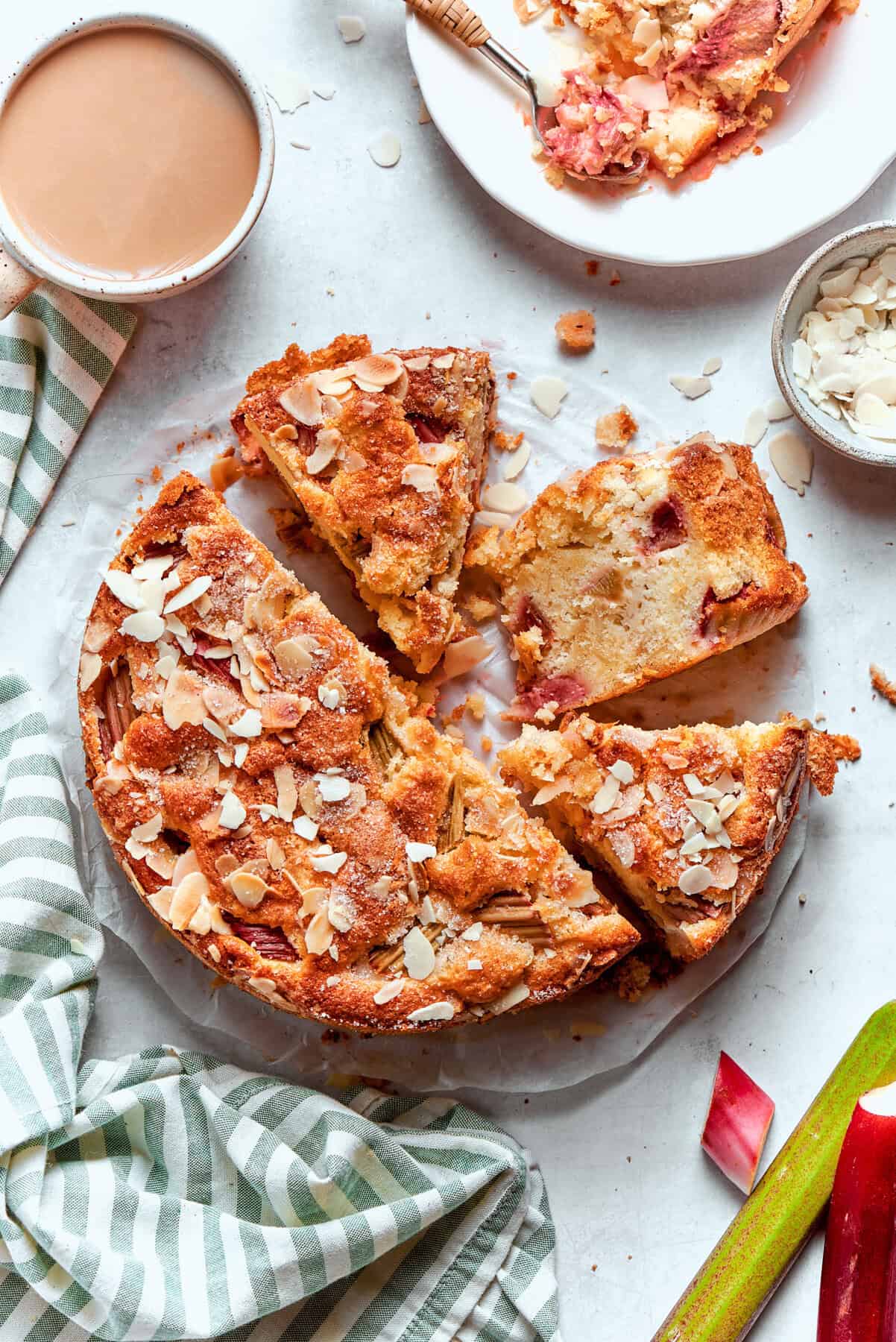 Overhead photo of a Norwegian Rhubarb Cake, sliced