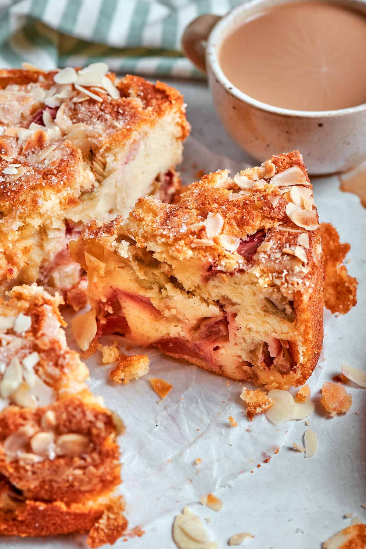 Slice of Norwegian rhubarb cake with cup of coffee.